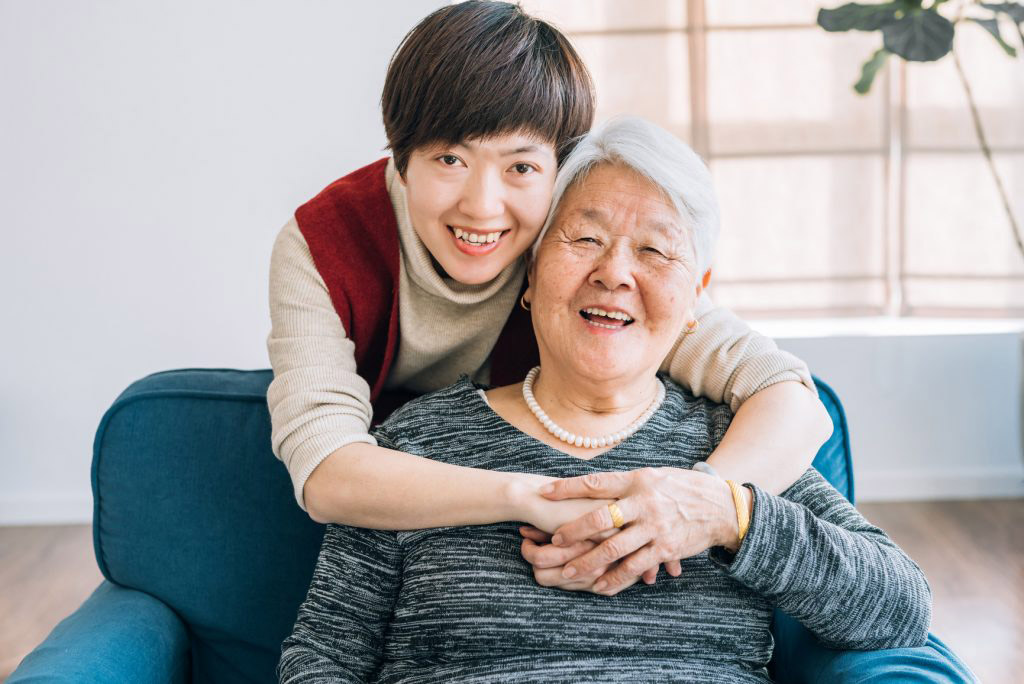 Girl and senior woman smiling